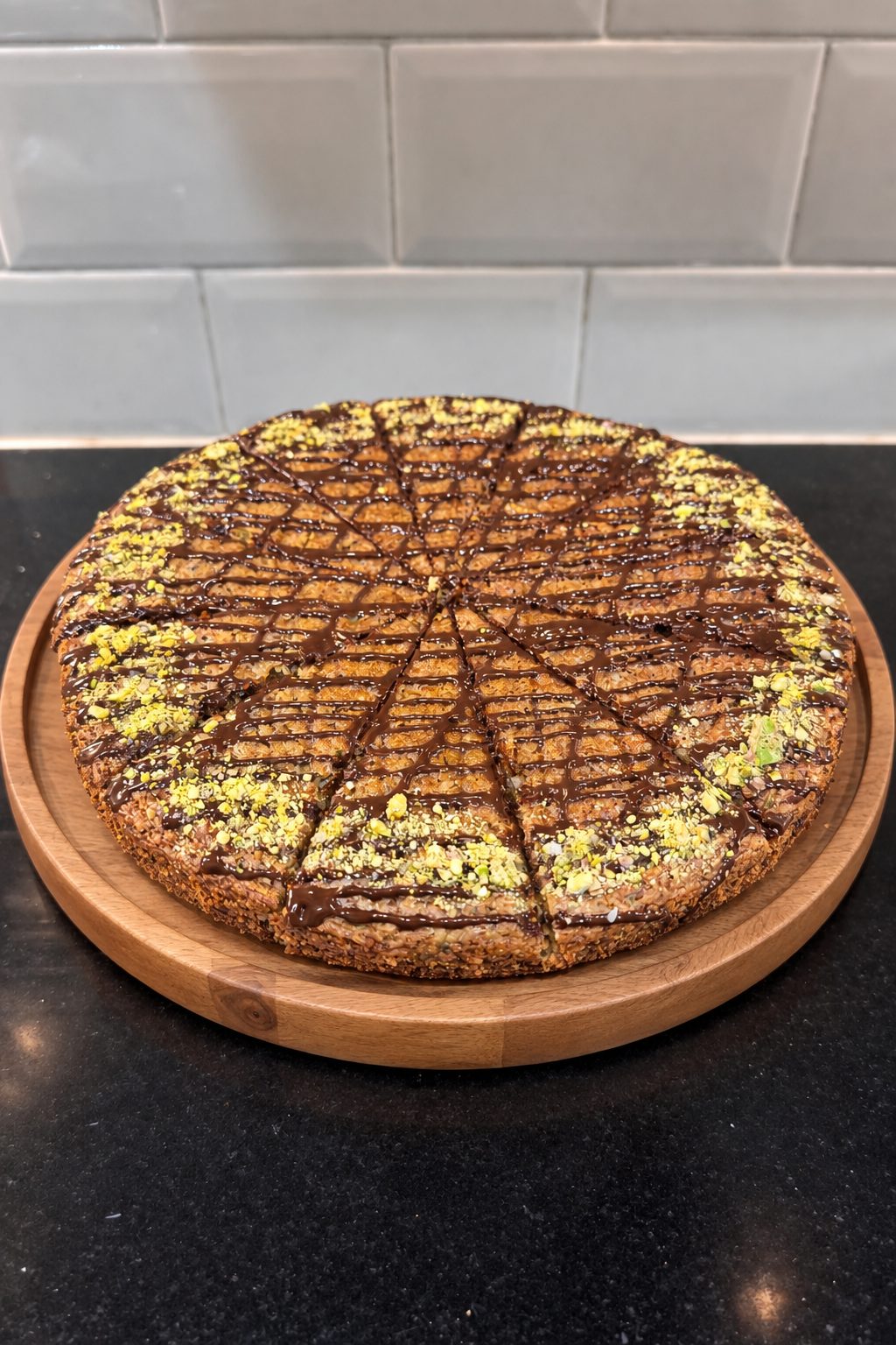 Courgette and pistachio cake with dark chocolate drizzle